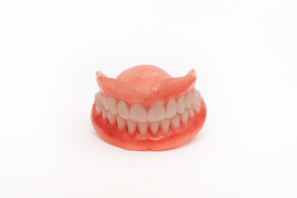 set of dentures on a white background two acrylic