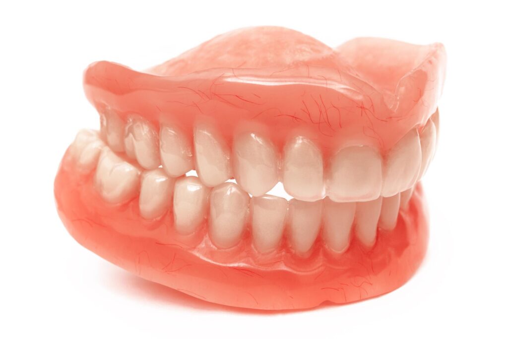 two acrylic dentures upper and lower jaws